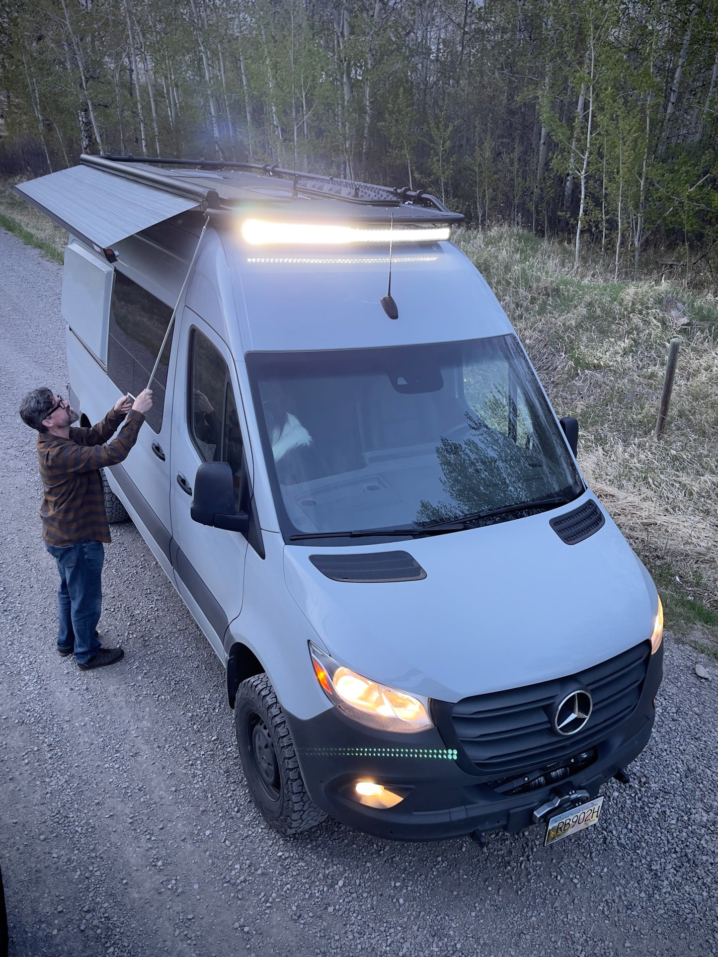 Person opening up their Fiamma Awning