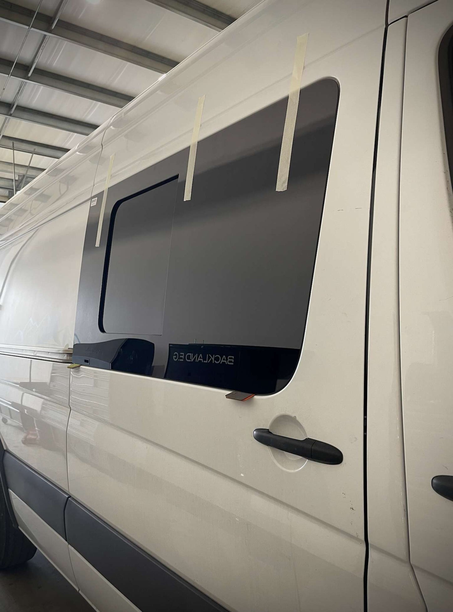 Exterior side view of AMA custom van windows