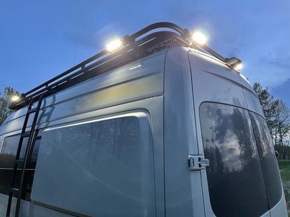 Sprinter roof rack with lights on.